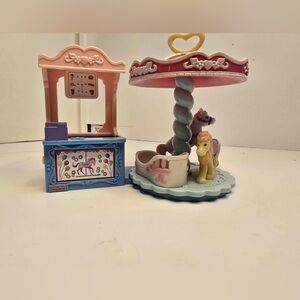 Fisher-Price Loving Family Sweet Streets Carousel and Ticket Booth playset.